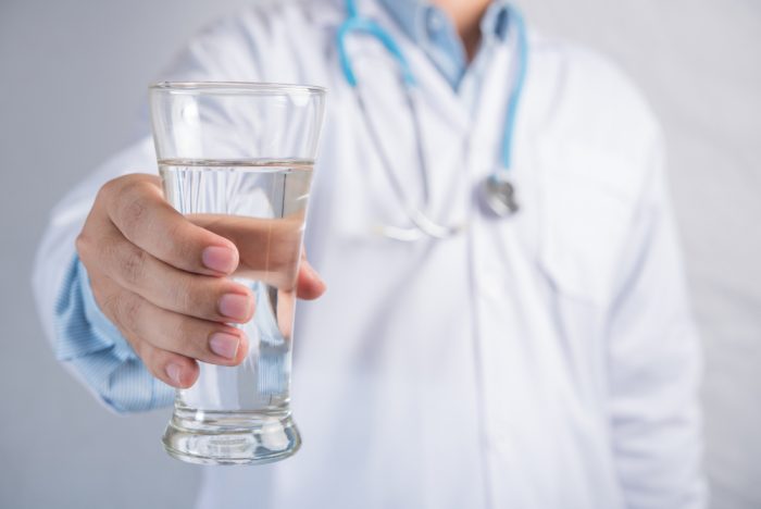 Why Is It Important to Drink Water After a Chiropractic Adjustment